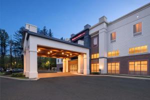 an exterior view of a building with a garage at Hampton Inn & Suites Berkshires-Lenox in Lenox