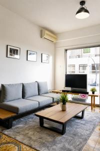 a living room with a couch and a coffee table at Swift Hostel Limassol in Limassol