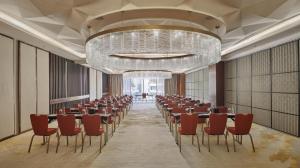 a conference room with tables and chairs and a chandelier at Hyatt Regency Riyadh Olaya in Riyadh +173 photos