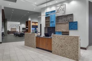an office lobby with a reception desk and a dj at Hyatt Place Athens Downtown in Athens