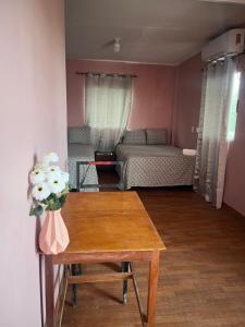 a living room with a table and a couch at Hotel Atlántida in La Ceiba +12 photos
