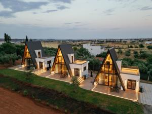 an aerial view of a house with glass windows at Trilogy Resorts in Alexandroupoli
