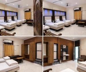 a living room with white couches and a table at Hotel Volga 2 in Mumbai