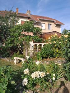 a garden in front of a house at Au chant des mandarins 2 gites de 15 personnes et un 3ème gite à proximité de 12 in Charmes