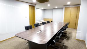 a large conference room with a long table and chairs at Hotel Interciti in Daejeon