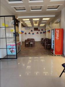 a banquet hall with tables and chairs in a room at Deep residency in Bharatpur