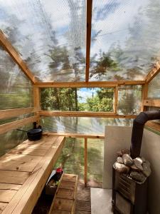 an inside view of a house with a large window at Orjaku Sadamavaade in Orjaku