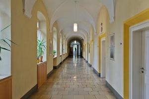 an empty hallway in a building with arches at Jugendhaus St. Kilian in Miltenberg