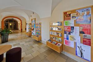 a book store with posters on the walls and a hallway at Jugendhaus St. Kilian in Miltenberg
