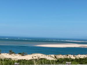 a view of the ocean from a beach at studio à deux pas du bassin in Arcachon