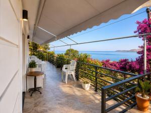a balcony with a view of the water at Monarch Beach in Borsh