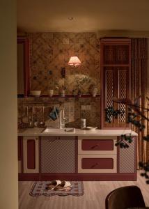a kitchen with a sink and a counter at LangX Ecopark Sky Forest - Dolce Apartment in Kim Quan