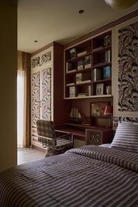 a bedroom with two beds and a chair in it at LangX Ecopark Sky Forest - Dolce Apartment in Kim Quan