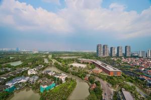 an aerial view of a city with a river and buildings at LangX Ecopark Sky Forest - Dolce Apartment in Kim Quan
