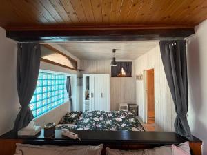 a bedroom with a bed and a window at Il Nido Viola in Arbedo-Castione