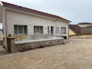 a house with a porch with chairs on it at La Bergerie 3 in Neufchâteau