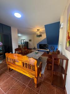 a living room with a wooden bench and a table at Anawin Bungalows in Ao Nang Beach