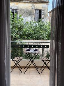 a view of a balcony with a table and chairs at Alasrooms A1 in Missolonghi