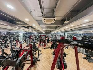 a gym with a bunch of exercise bikes in it at ART'OTEL Ximending TAIPEI in Taipei