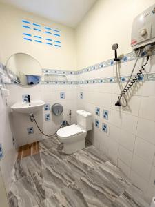 a bathroom with a toilet and a sink at Anawin Bungalows in Ao Nang Beach +56 photos