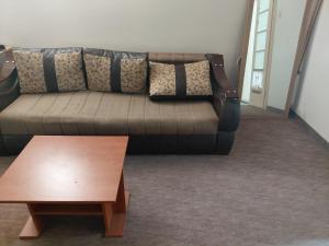a living room with a couch and a coffee table at Marinel in Vršac