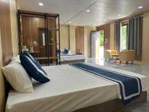 a bedroom with a large bed in a room at Sea DoSon Resort in Ðố Sơn