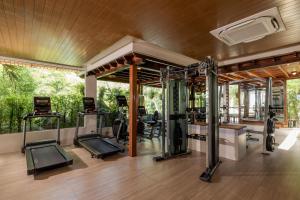 an image of a gym with treadmills and ellipticals at Muang Samui Spa Resort in Chaweng