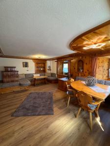 a large living room with a table and a couch at Thalerhof-Markus in Roppen