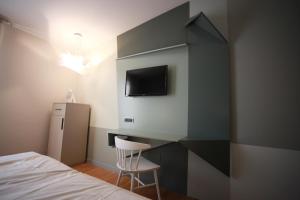 TV a/nebo společenská místnost v ubytování Hotel Corte Quadri