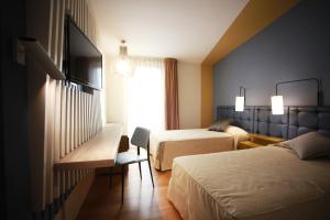 Postel nebo postele na pokoji v ubytování Hotel Corte Quadri + 33 fotografií