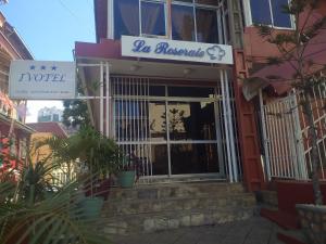 a building with a sign that reads no hairdresser at Ivotel in Antananarivo
