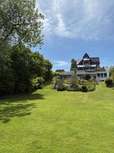 a large yard with a large house at Seehaus Plön in Plön
