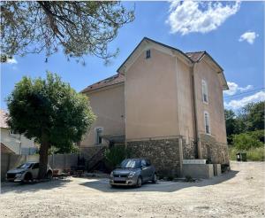 a car parked in front of a large building at Bulle de détente - Proche Disney in Villiers-sur-Morin