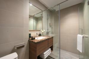 a bathroom with a sink and a mirror at Reviah Hotel in Hanoi +54 photos
