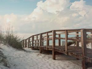 a wooden boardwalk on the beach in the sand at Esperance Little Units 3 in Esperance