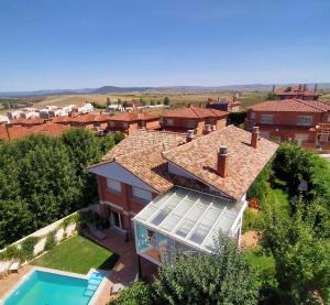 an aerial view of a house with a swimming pool at La Casita de Numancia in Garray