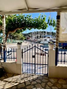 a gate with a view of a marina at Joanna Seaside House in Meganisi