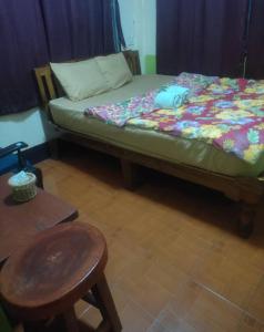 a bed with a pillow on it in a room at ชมภูนุช ห้องพัก เกาะล้าน in Ko Larn