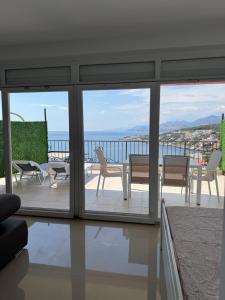 a living room with a view of the ocean at SunsetEscape Apartments Utjeha in Utjeha