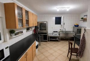 a kitchen with a sink and a counter top at Rooms Ava Raj in Međugorje +15 photos