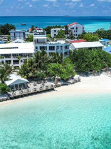 an aerial view of the beach in front of a resort at Rashu Hiyaa Hotel in Dhiffushi