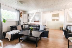 a living room with a couch and a table at Ferienhaus Steinhoff in Marsberg