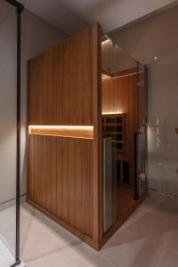a wooden wall with a glass door in a room at Roxburghe Cottages, part of Destination by Hyatt in Kelso +46 photos