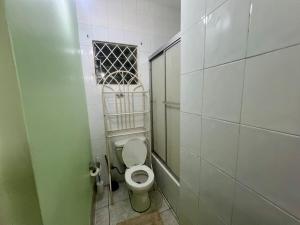 a small bathroom with a toilet in a stall at Ava s Cozy Studio in Tunbridge