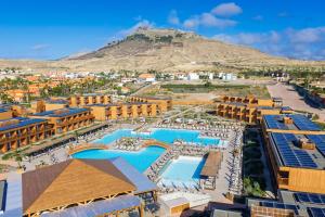 an aerial view of a resort with a mountain in the background at Pestana Dunas All Inclusive in Porto Santo
