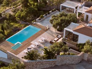 an aerial view of a villa with a swimming pool at PanoPlagia Villa in Agios Nikolaos
