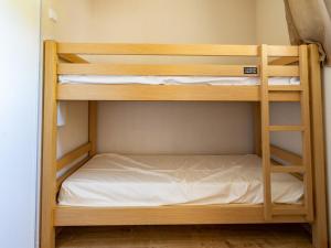 a bunk bed room with two bunk beds at Les Chalets d Ax N 303 - 2P4C in Ax-les-Thermes
