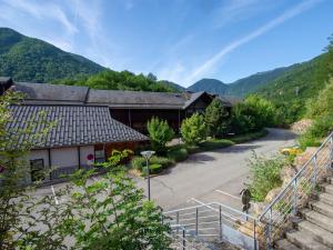 a building with a staircase leading up to a road at Les Chalets d Ax N 303 - 2P4C in Ax-les-Thermes