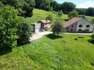 an aerial view of a house in a field at Gîte du Mont Gérard in La Lanterne-et-les-Armonts