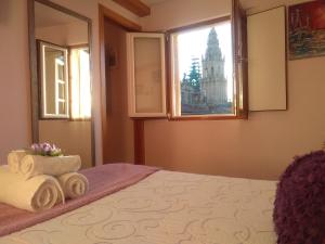 Łóżko lub łóżka w pokoju w obiekcie Apartamentos Casa de La Inmaculada